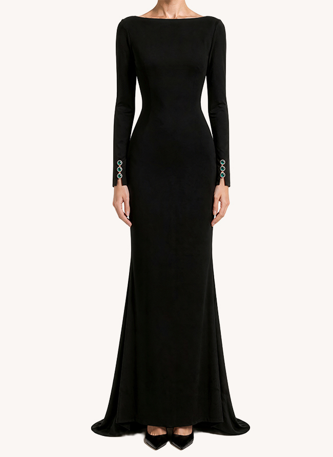 L'Heure Verte seen from the front, a black column gown with bateau neckline and emerald-set cuffs